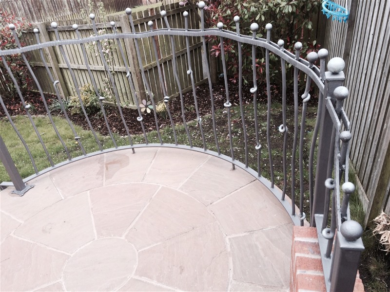Curved wrought iron railings